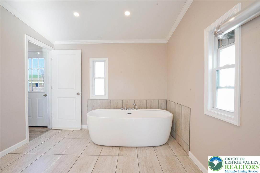 7221 Borman Road New Tripoli, PA 18066 - Photo 28 of 62 a bathroom with a bathtub and window