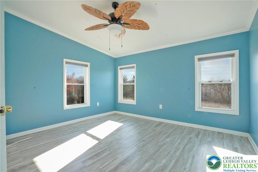 7221 Borman Road New Tripoli, PA 18066 - Photo 31 of 62 a view of an empty room with a window and wooden floor