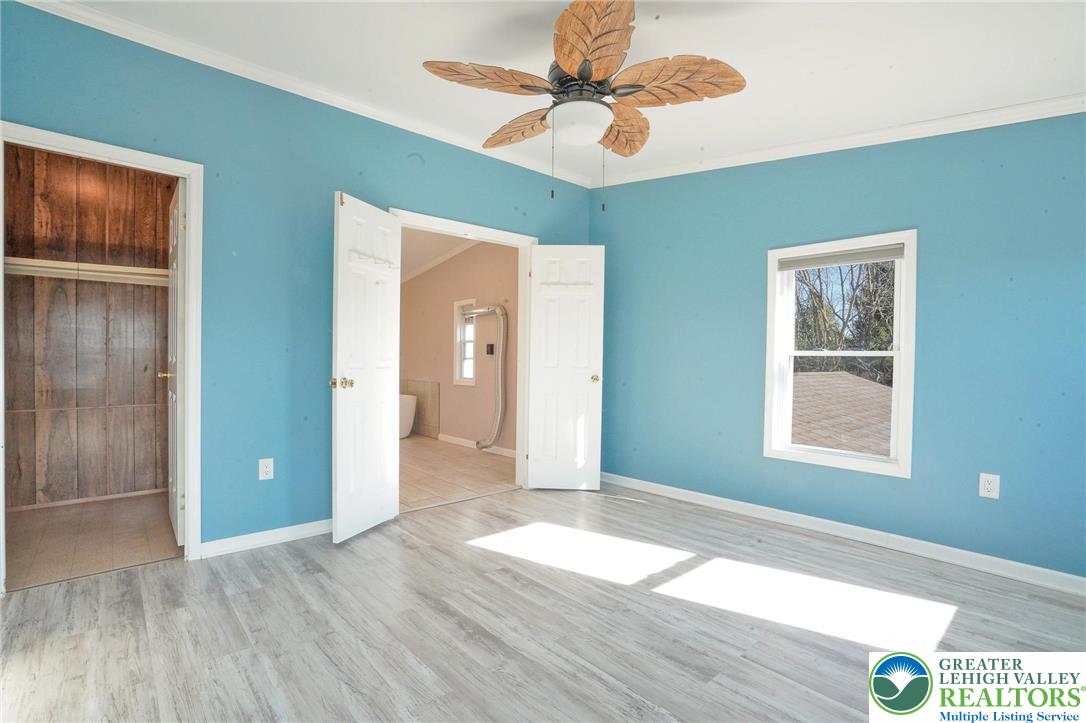 7221 Borman Road New Tripoli, PA 18066 - Photo 32 of 62 a view of an empty room with window and wooden floor