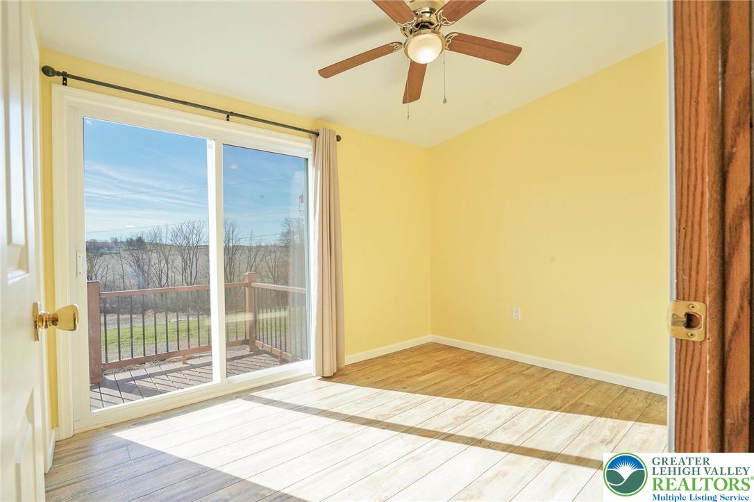 7221 Borman Road New Tripoli, PA 18066 - Photo 35 of 62 a view of an empty room with wooden floor and a window