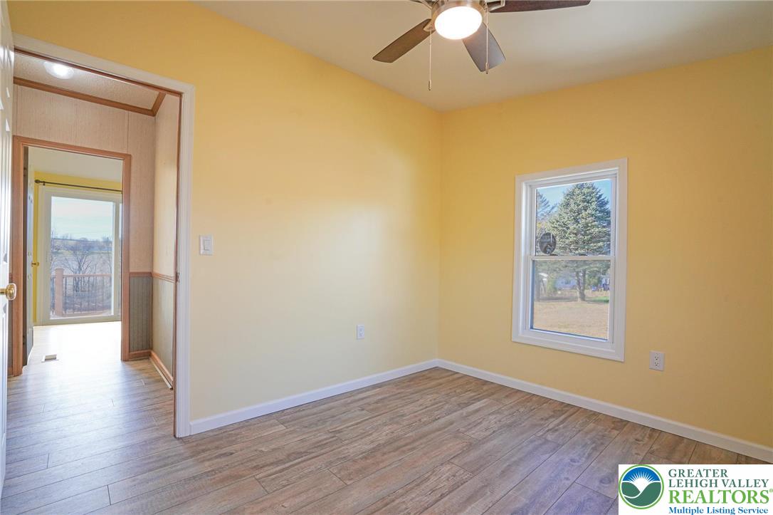 7221 Borman Road New Tripoli, PA 18066 - Photo 43 of 62 a view of an empty room with wooden floor and a window