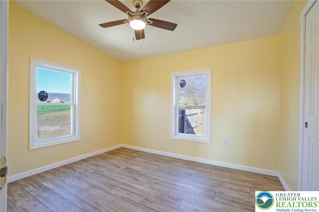 7221 Borman Road New Tripoli, PA 18066 - Photo 44 of 62 a view of an empty room with wooden floor and a window