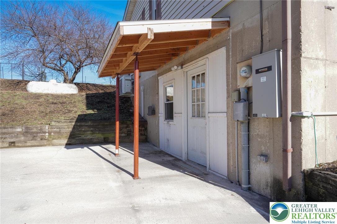 7221 Borman Road New Tripoli, PA 18066 - Photo 57 of 62 a view of a house with a wooden bench