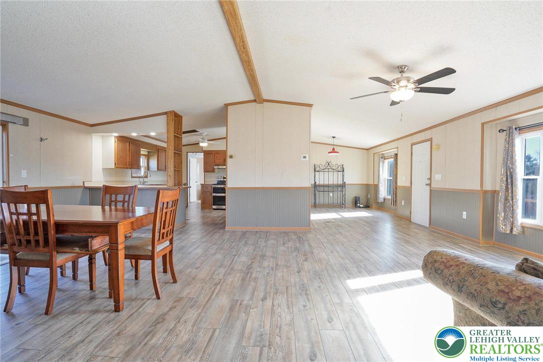 7221 Borman Road New Tripoli, PA 18066 - Photo 8 of 62 a living room with couches and kitchen view with wooden floor