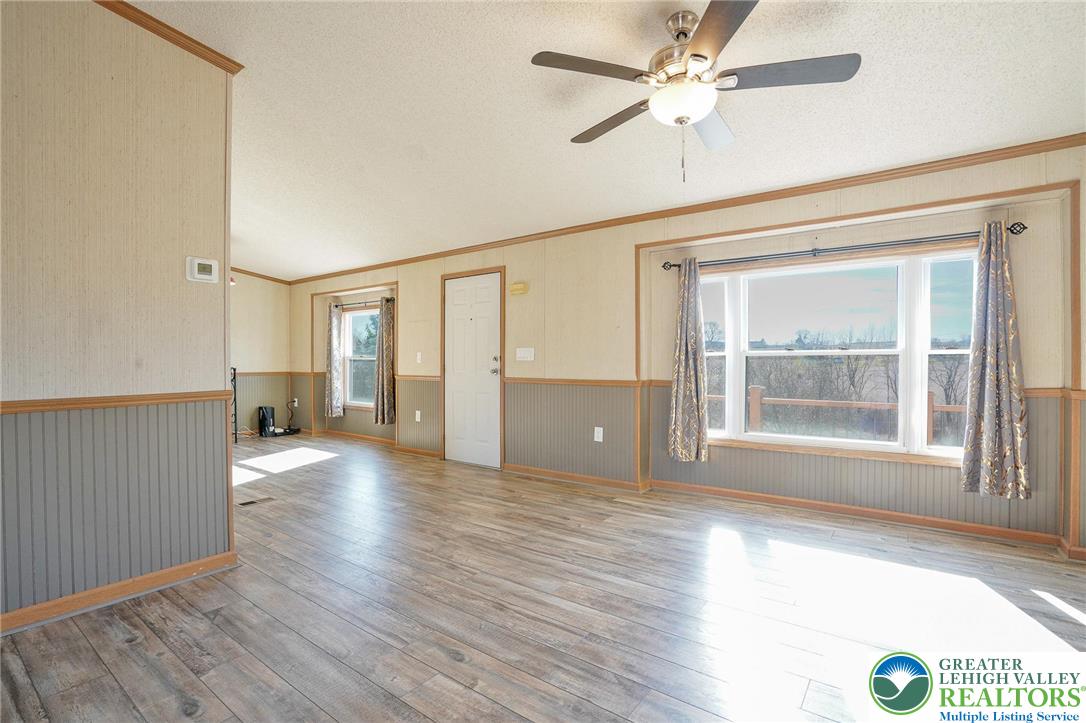 7221 Borman Road New Tripoli, PA 18066 - Photo 9 of 62 a view of an empty room with a window and wooden floor