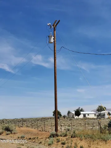 a street sign on a sidewalk next to a road
