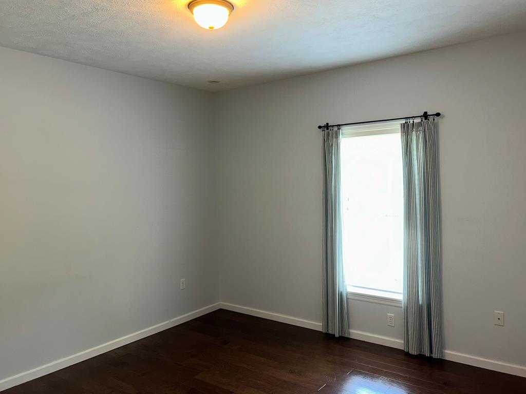 114 Oak Ridge Drive Clarion, PA 16214 - Photo 28 of 38 an empty room with wooden floor and windows