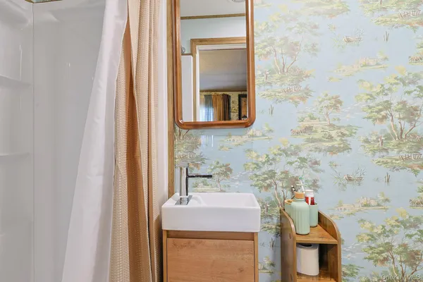 a bathroom with a sink and a mirror