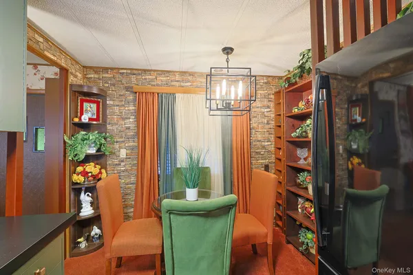 a view of a living room with furniture and a window