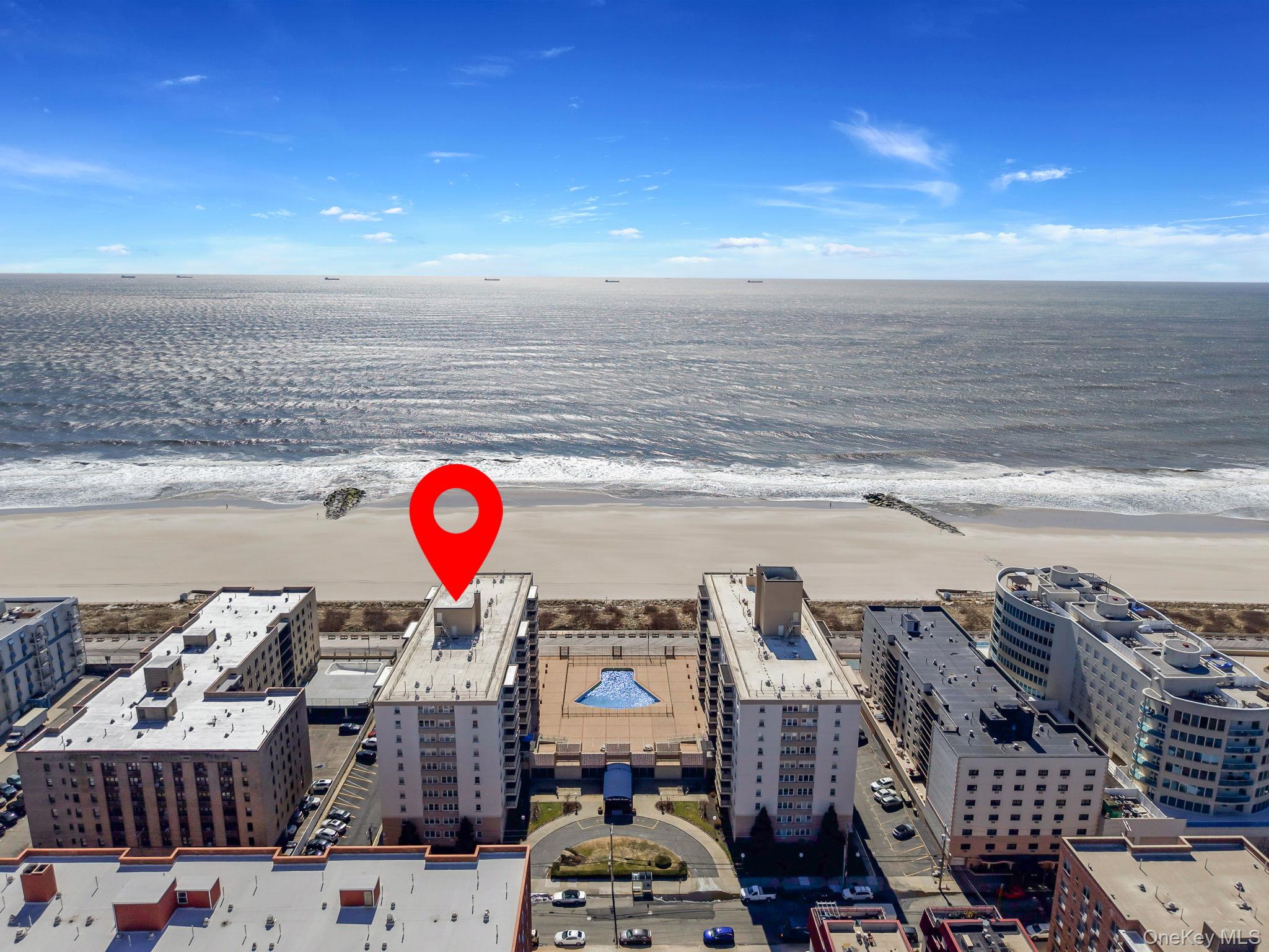 450 Shore Road, Unit 8G Long Beach, NY 11561 - Photo 4 of 19 a view of parking area with an ocean