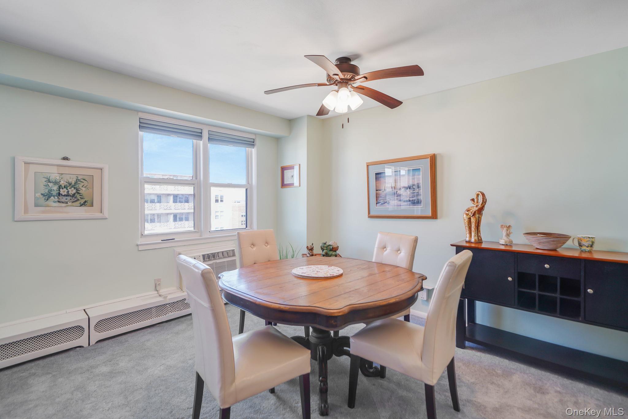 450 Shore Road, Unit 8G Long Beach, NY 11561 - Photo 7 of 19 a view of a dining room with furniture and window