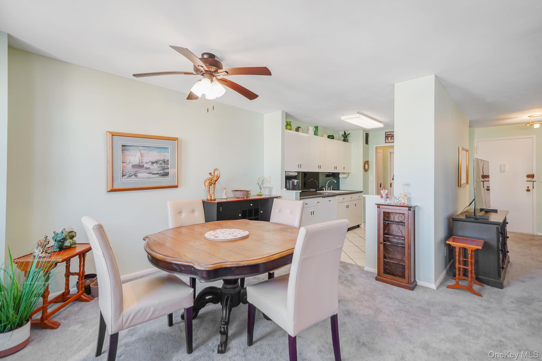 450 Shore Road, Unit 8G Long Beach, NY 11561 - Photo 8 of 19 a view of a dining room with furniture