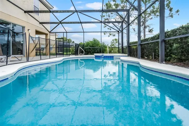 a view of a swimming pool with a patio