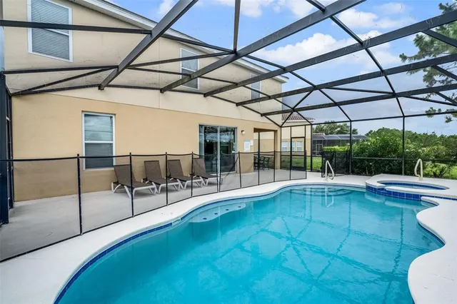a view of a swimming pool with a patio