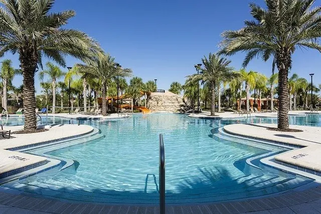 a view of a swimming pool with lounge chair