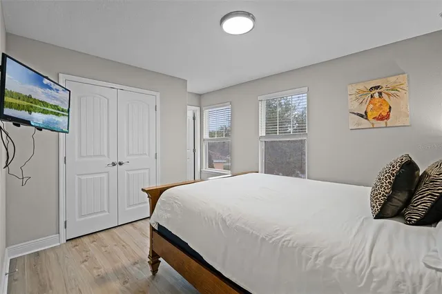 a bedroom with a bed and a window