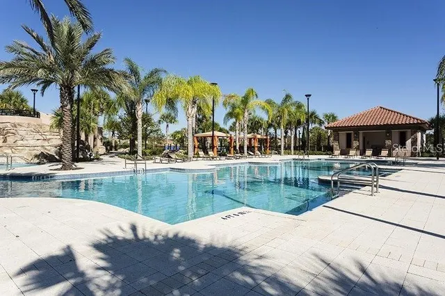 a view of a swimming pool with a patio