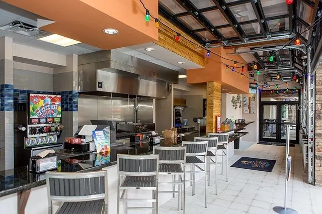 a room with lots of furniture and a chandelier