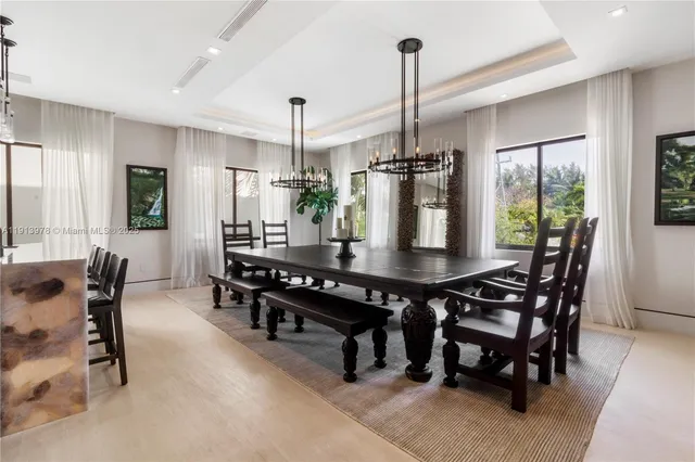 a large kitchen with a table and chairs in it