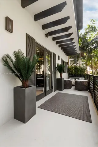 a spacious bedroom with a bed and a couch