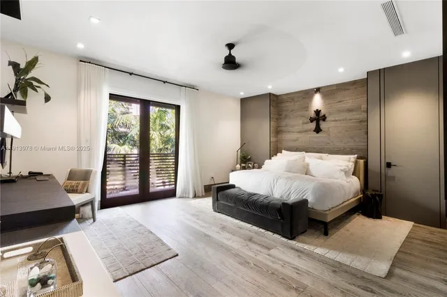 a bathroom with a double vanity sink and a large mirror