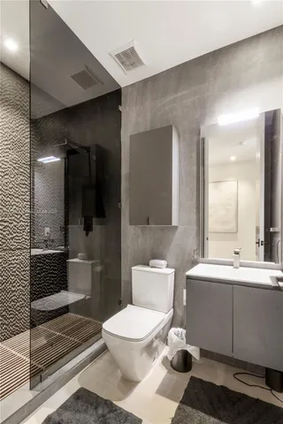 a bedroom with a bed a desk and chair