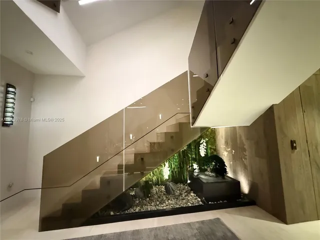 a large kitchen with stainless steel appliances kitchen island granite countertop a large counter top