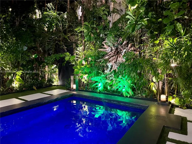 a view of a patio with wooden floor and iron stairs