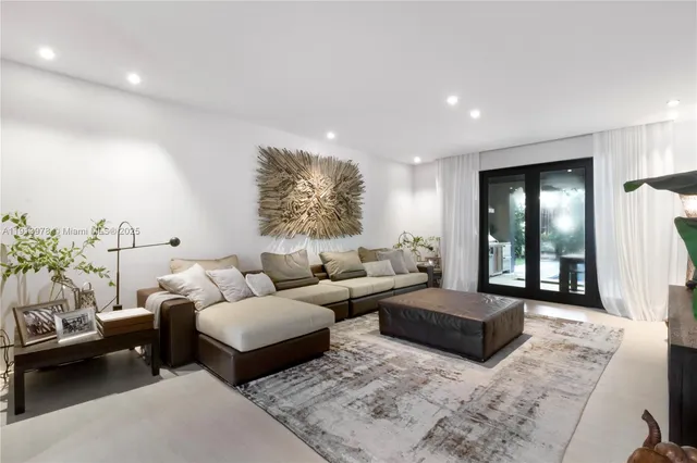 a living room with furniture and a rug