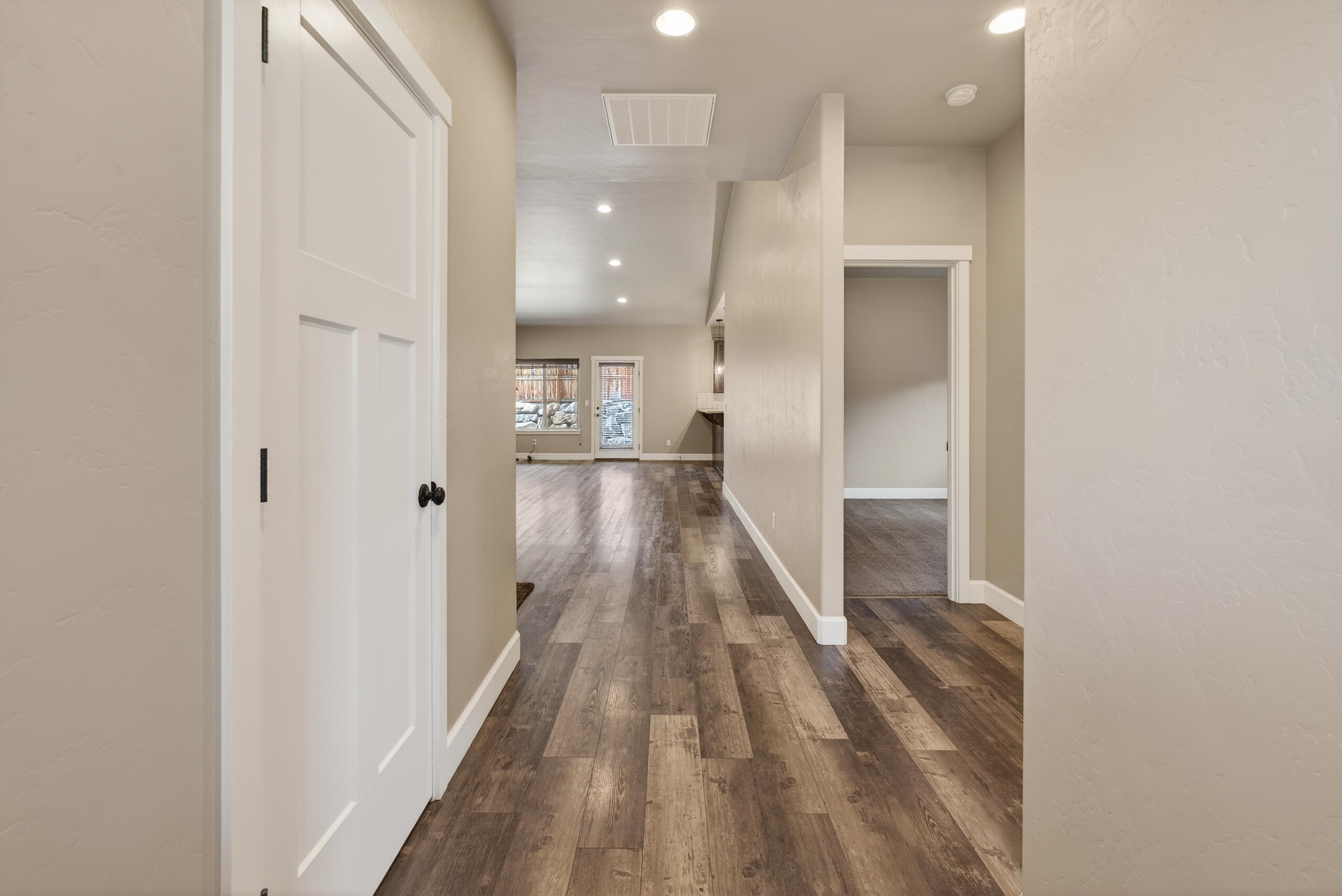 2793 Southwest 33rd Street Redmond, OR 97756 - Photo 6 of 44 a view of a hallway with wooden floor