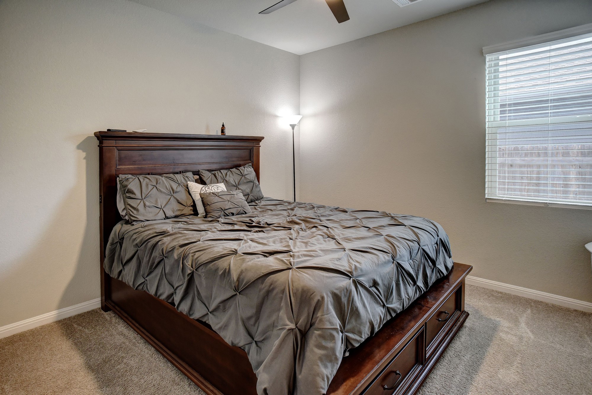 210 Cold Spg Loop Bastrop, TX 78602 - Photo 17 of 40 Bedroom with carpet flooring and a ceiling fan
