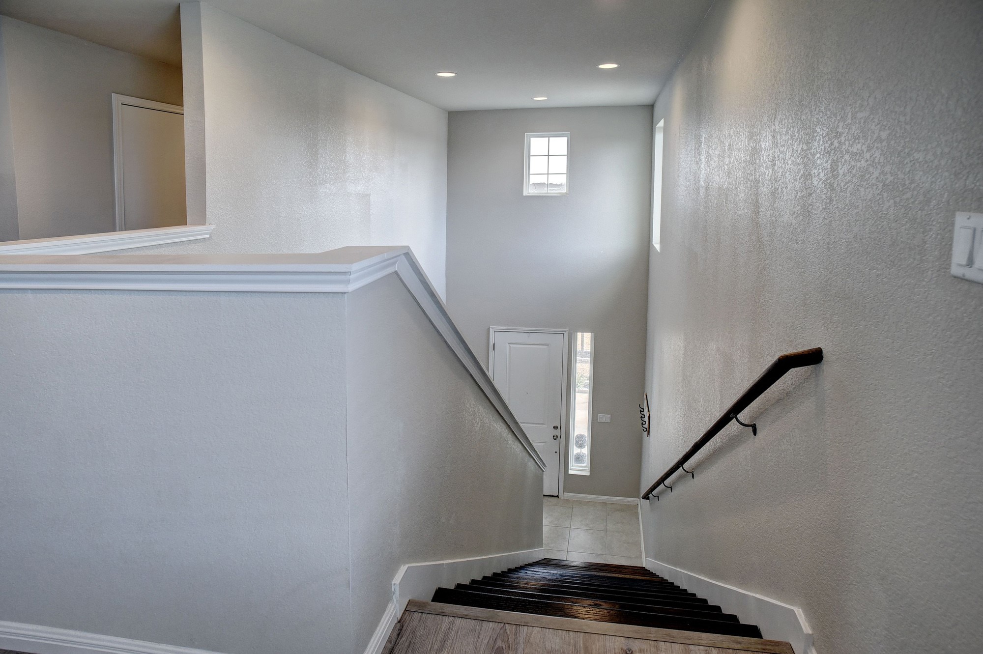 210 Cold Spg Loop Bastrop, TX 78602 - Photo 20 of 40 Staircase with baseboards and a textured wall