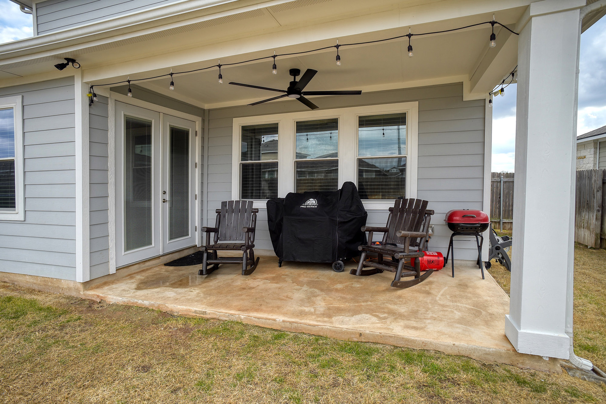 210 Cold Spg Loop Bastrop, TX 78602 - Photo 36 of 40 View of patio with area for grilling, a ceiling fan, and french doors