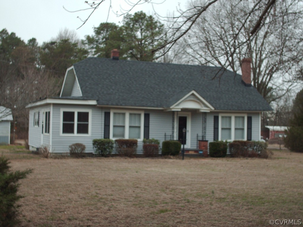 1521 Point Of Rocks Road Chester, VA 23836 - Photo 2 of 12 a front view of a house with garden