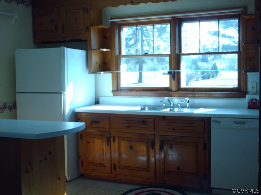 1521 Point Of Rocks Road Chester, VA 23836 - Photo 8 of 12 a kitchen with a sink cabinets and a large window
