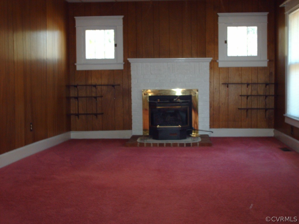 1521 Point Of Rocks Road Chester, VA 23836 - Photo 9 of 12 an empty room with windows and fireplace