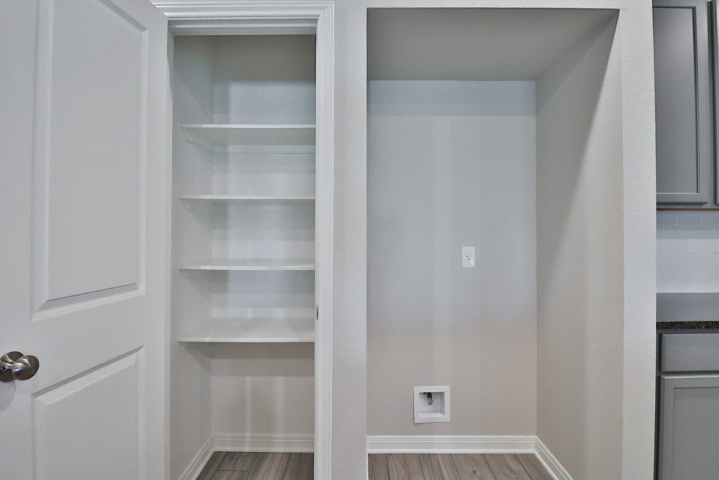 1926 Viva Road Bryan, TX 77807 - Photo 13 of 39 a view of walk in closet with empty racks