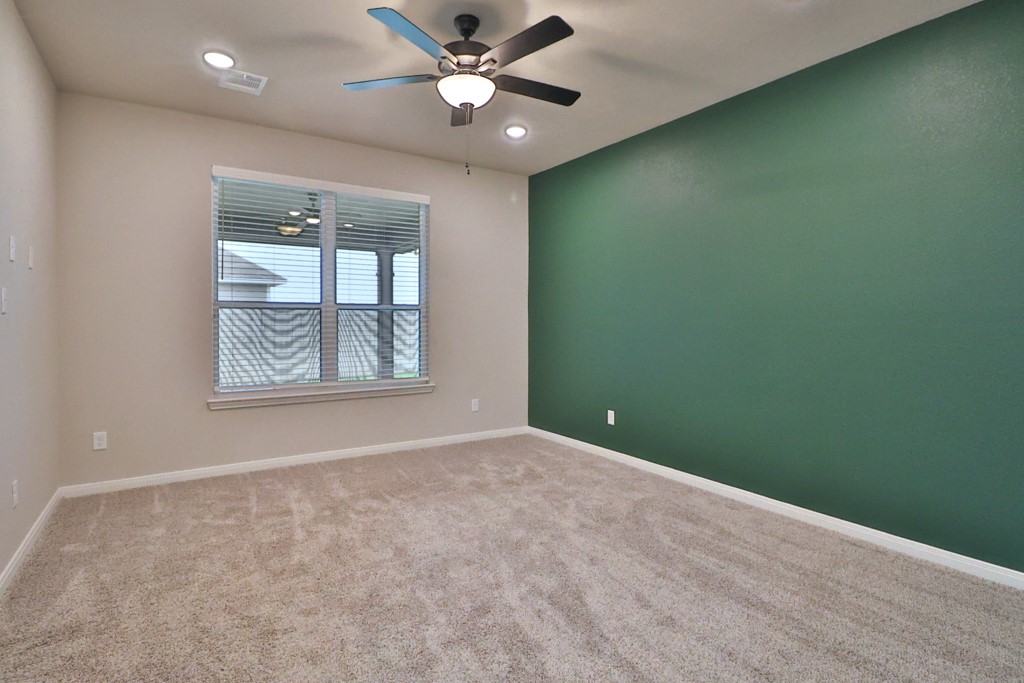 1926 Viva Road Bryan, TX 77807 - Photo 19 of 39 an empty room with windows and fan