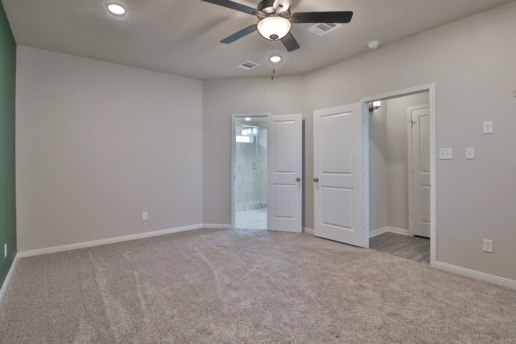 1926 Viva Road Bryan, TX 77807 - Photo 20 of 39 an empty room with fan and entrance