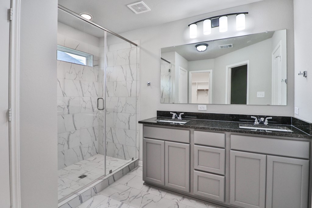 1926 Viva Road Bryan, TX 77807 - Photo 21 of 39 a bathroom with a granite countertop sink mirror and double