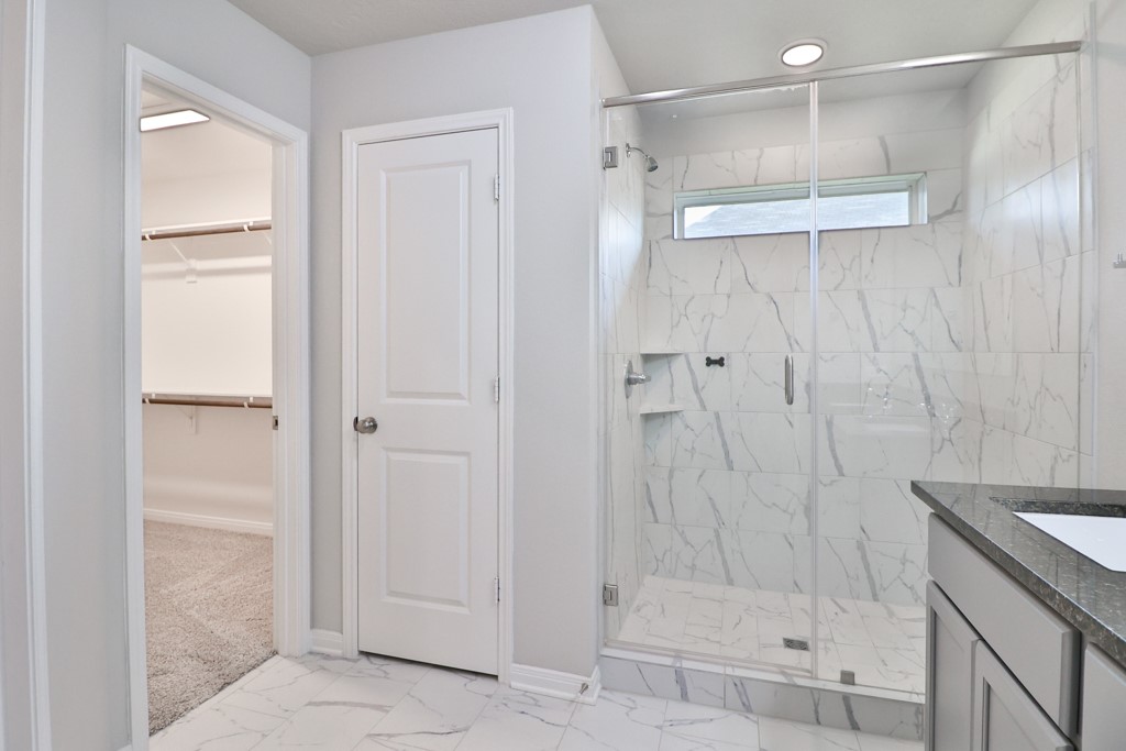 1926 Viva Road Bryan, TX 77807 - Photo 23 of 39 a bathroom with a shower and a sink
