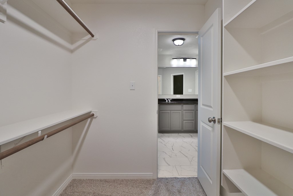1926 Viva Road Bryan, TX 77807 - Photo 25 of 39 a bathroom with a sink a mirror and a toilet