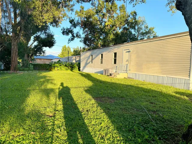 a view of a swimming pool with a garden