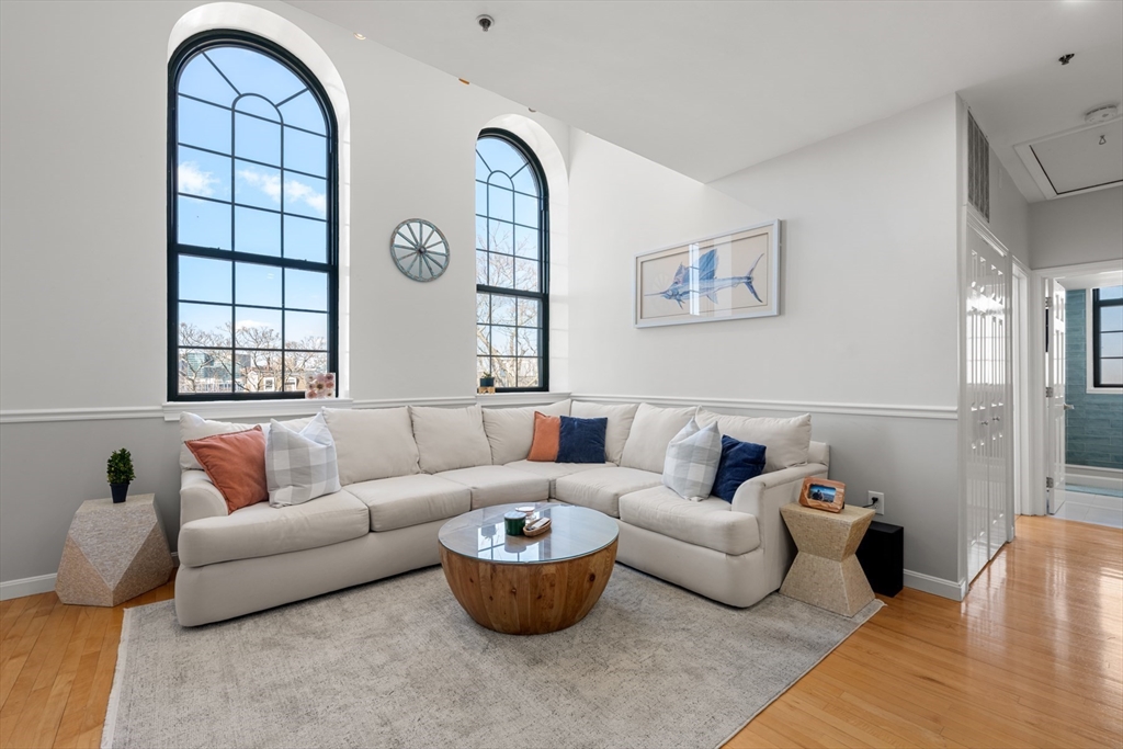486 East 3rd Street, Unit 6 Boston, MA 02127 - Photo 1 of 20 a living room with furniture and a large window