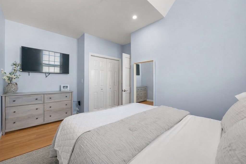 486 East 3rd Street, Unit 6 Boston, MA 02127 - Photo 12 of 20 a bedroom with a bed and a flat screen tv