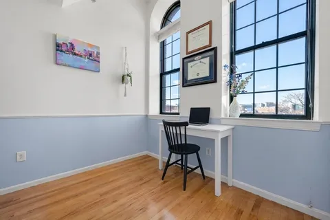 a workspace with furniture and a window