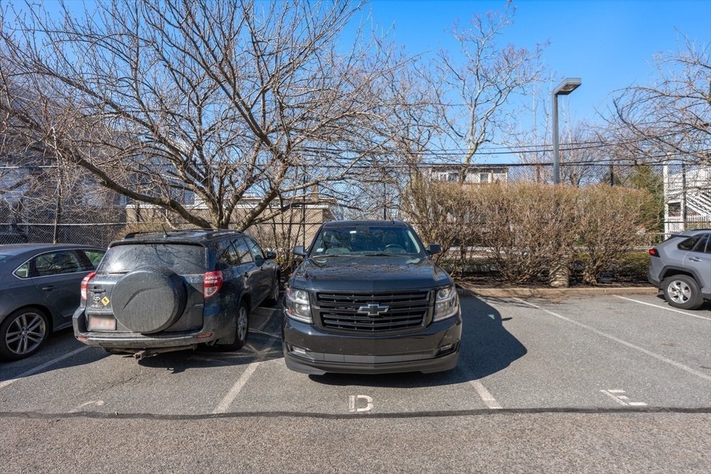 486 East 3rd Street, Unit 6 Boston, MA 02127 - Photo 18 of 20 a car parked in front of a house