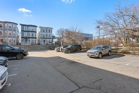a view of street with parked cars