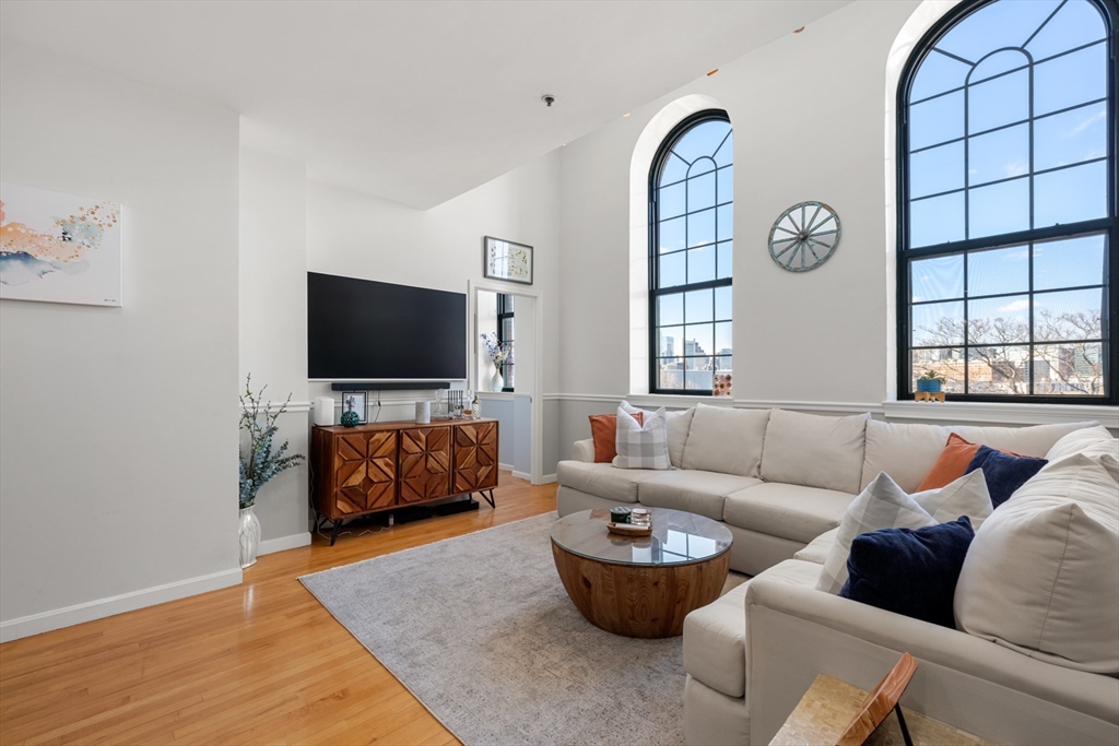 486 East 3rd Street, Unit 6 Boston, MA 02127 - Photo 3 of 20 a living room with furniture and a flat screen tv