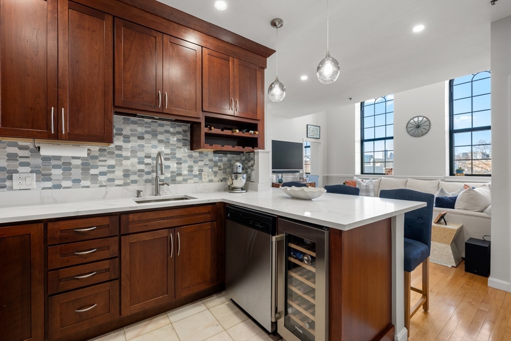 486 East 3rd Street, Unit 6 Boston, MA 02127 - Photo 7 of 20 a kitchen with a sink cabinets and wooden floor